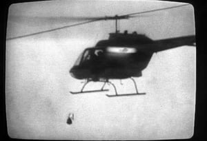 A police helicopter drops the bomb on the MOVE compound on May 13, 1985, as captured by a Channel 10-WCAU camera.